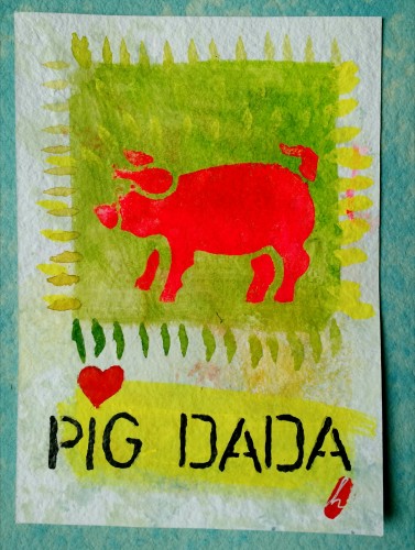 Green painted background with bright orange pig stenciled in the middle and the name 